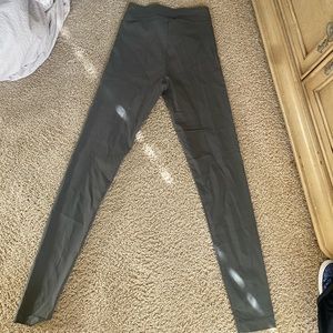 Dark green ladies stretch pants .
